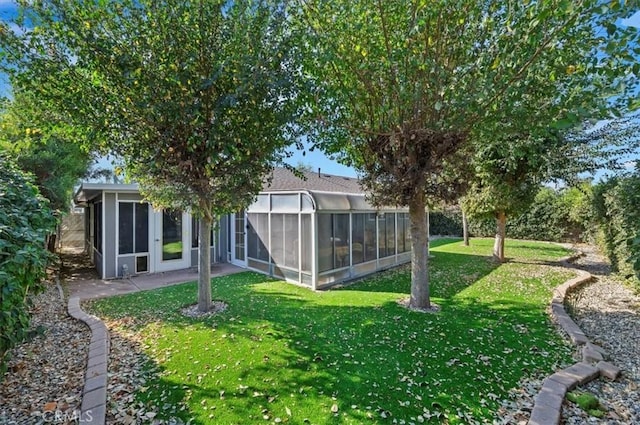 view of yard with a sunroom