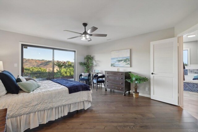 bedroom with ceiling fan, dark hardwood / wood-style floors, and access to exterior