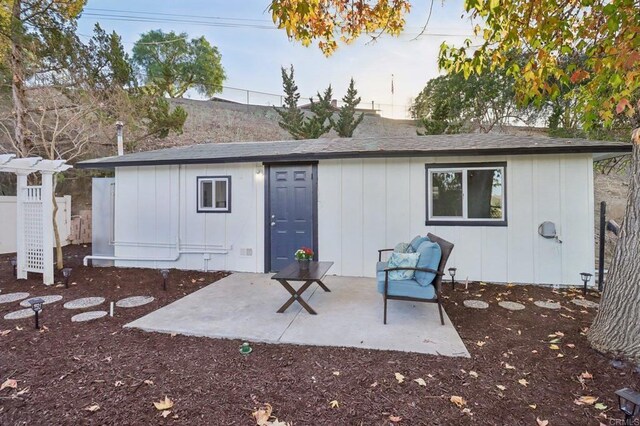 back of house with a patio area