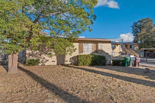 single story home with fence