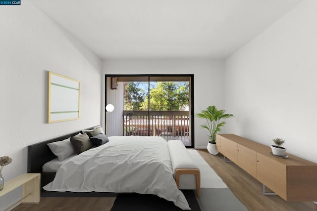 bedroom with hardwood / wood-style flooring and access to exterior