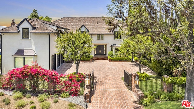 tudor home featuring a garage