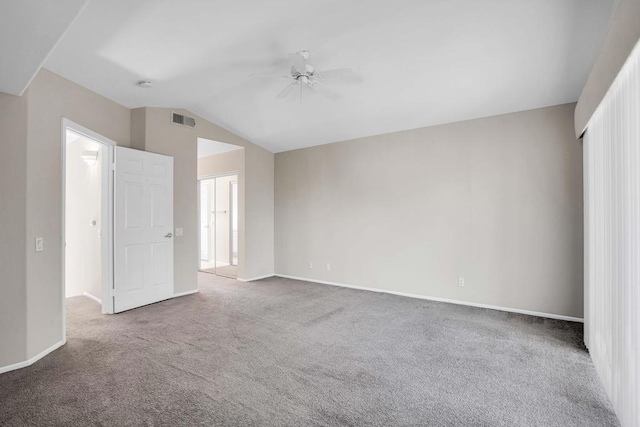 unfurnished bedroom with ceiling fan, carpet, and vaulted ceiling