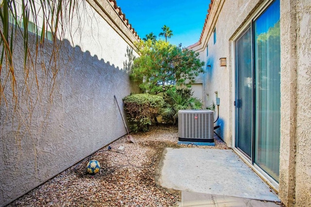 view of side of property featuring central air condition unit