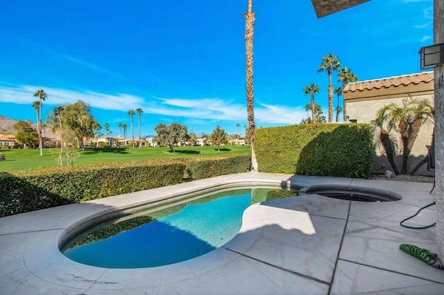 view of pool with an in ground hot tub