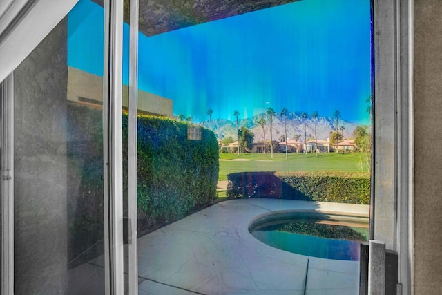 view of pool with a yard and a patio