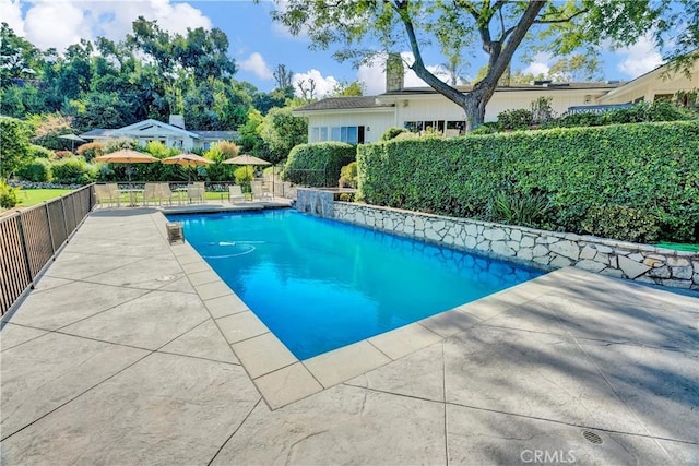 view of swimming pool featuring a patio