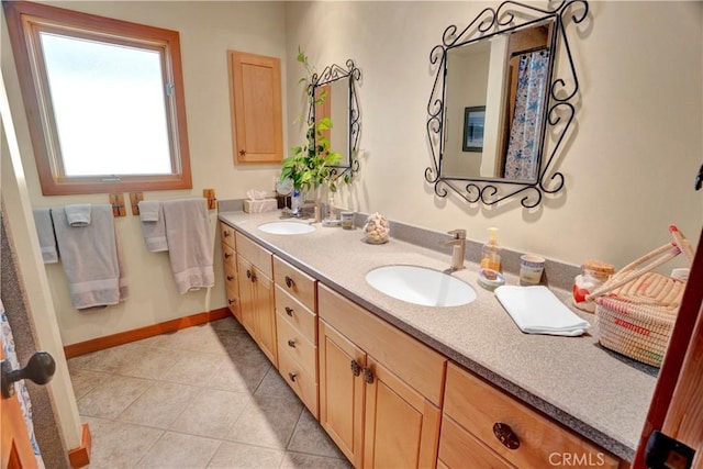 bathroom with tile patterned floors and vanity