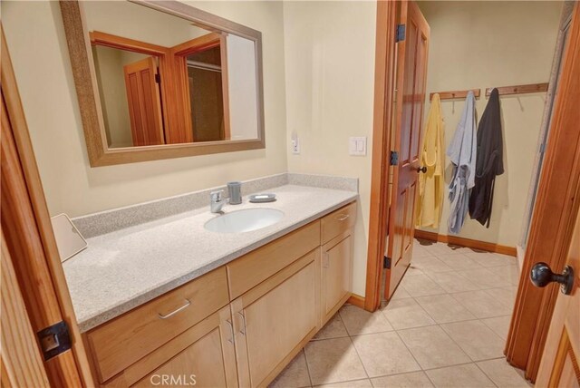 bathroom featuring tile patterned flooring and vanity