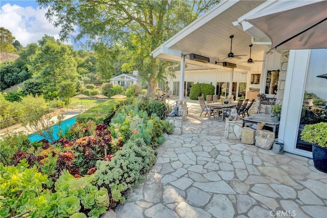 view of patio featuring ceiling fan