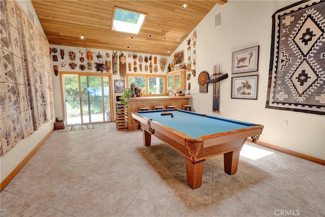 rec room with a skylight, wood ceiling, billiards, light tile patterned flooring, and high vaulted ceiling