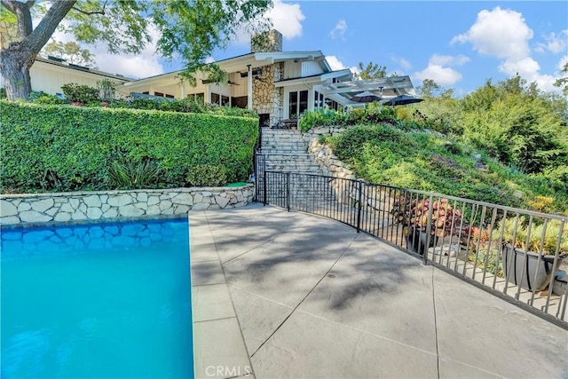 view of swimming pool with a patio