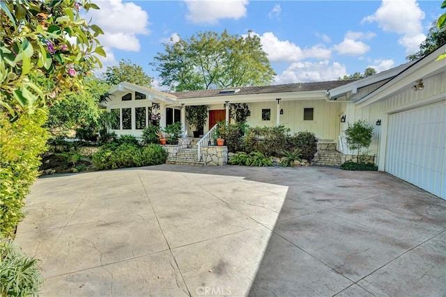 view of patio / terrace featuring a garage