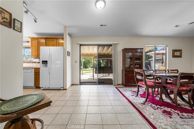 tiled dining area with a wealth of natural light