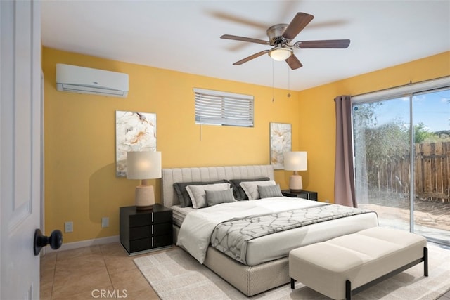 tiled bedroom with access to outside, ceiling fan, and an AC wall unit