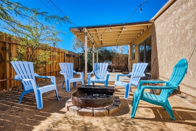 view of patio / terrace with an outdoor fire pit