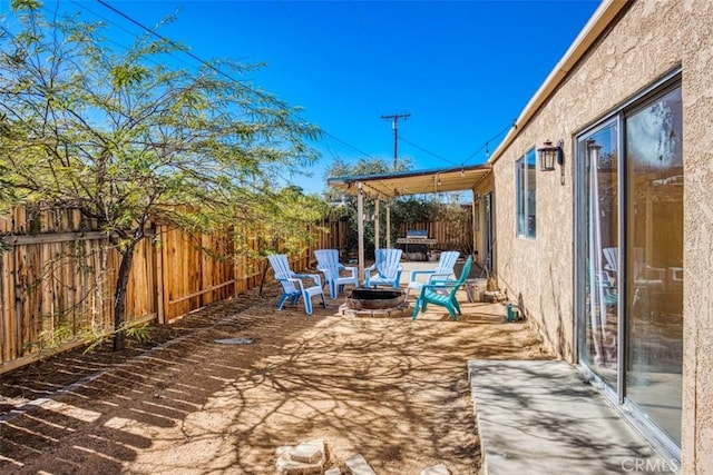 view of patio / terrace with an outdoor fire pit