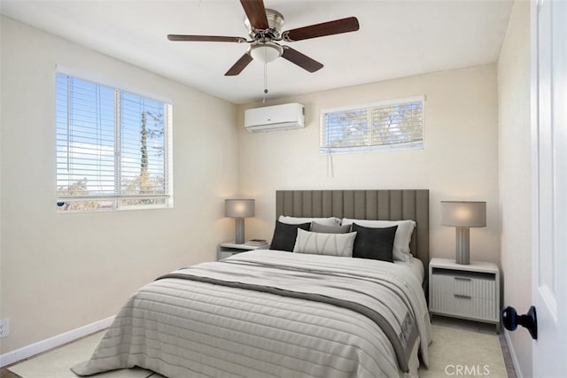 bedroom with ceiling fan and an AC wall unit