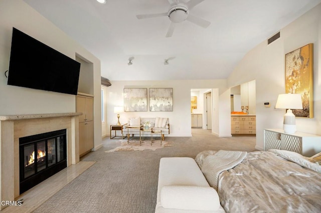 living room with ceiling fan, light colored carpet, and lofted ceiling