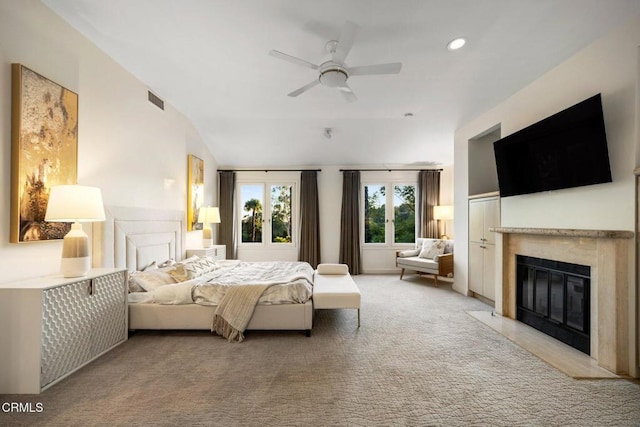 carpeted bedroom featuring ceiling fan and lofted ceiling