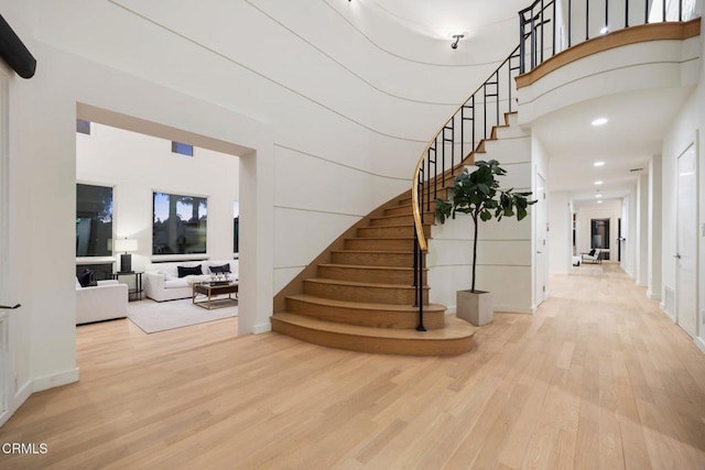 stairs with hardwood / wood-style flooring