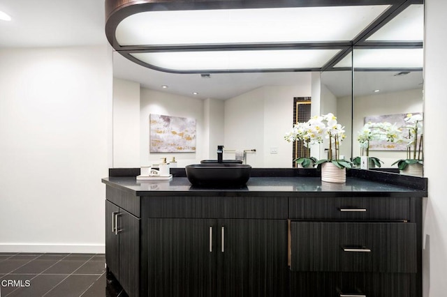 bathroom with tile patterned flooring and vanity