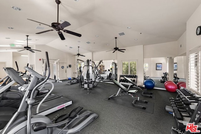 exercise room with vaulted ceiling