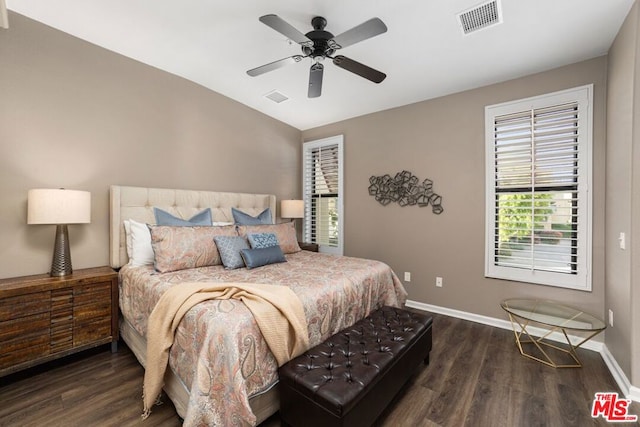 bedroom with ceiling fan and dark wood-type flooring