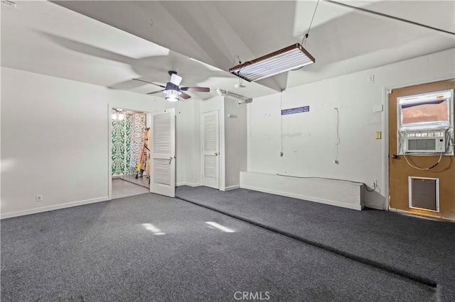 garage featuring ceiling fan and cooling unit