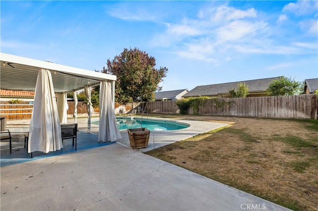 view of swimming pool featuring a yard and a patio