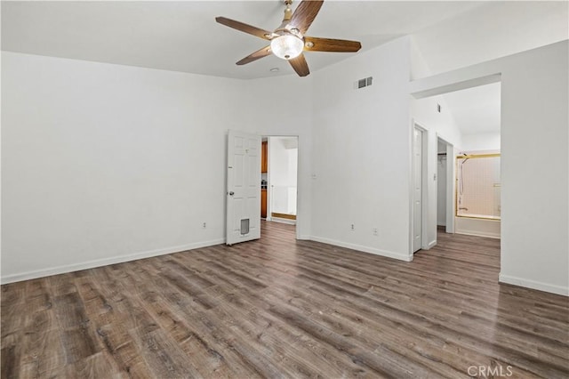 unfurnished room with vaulted ceiling, ceiling fan, and dark hardwood / wood-style floors