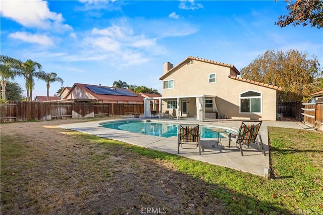 view of pool featuring a yard and a patio