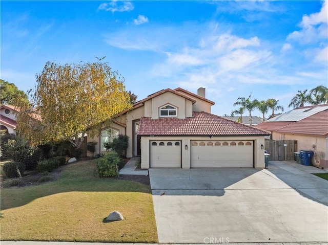 view of front of property with a garage and a front lawn