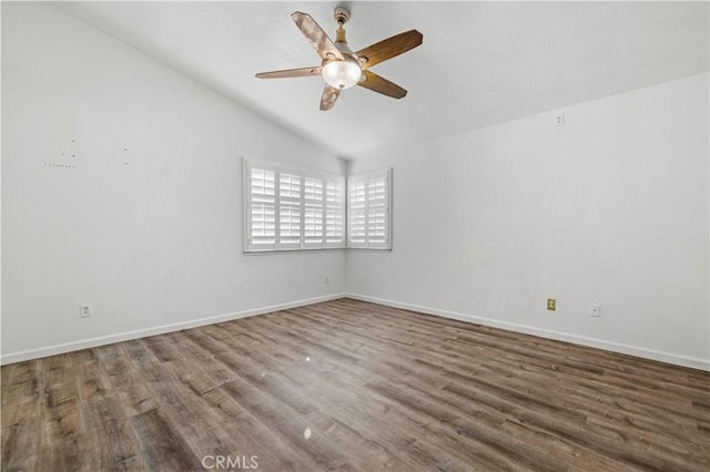 spare room with ceiling fan, hardwood / wood-style floors, and vaulted ceiling