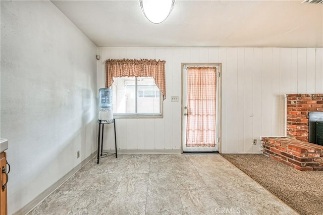 living room with wooden walls