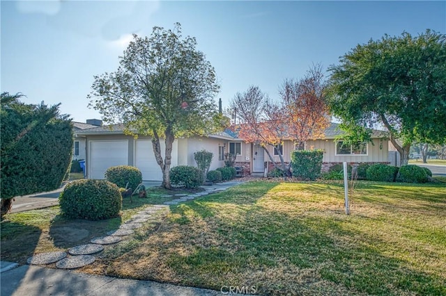 single story home featuring a front yard and a garage