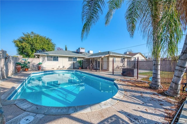 view of pool featuring cooling unit and a patio