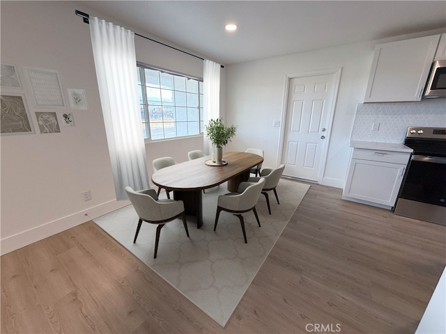 dining space featuring light hardwood / wood-style flooring