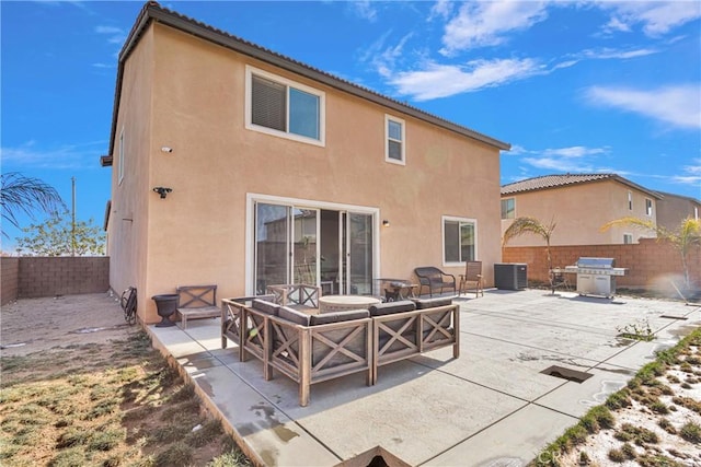 back of property with cooling unit, an outdoor hangout area, and a patio