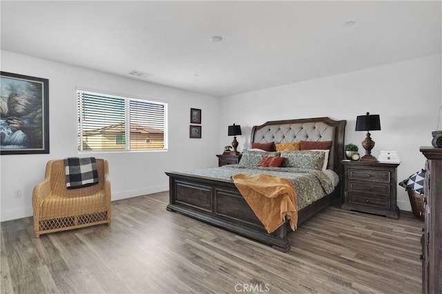 bedroom featuring wood-type flooring