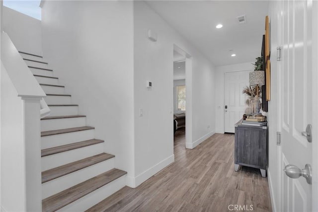 hall with light hardwood / wood-style flooring