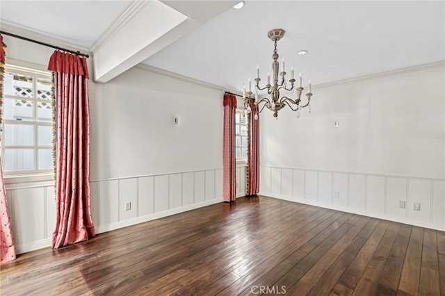 unfurnished dining area with crown molding, hardwood / wood-style flooring, and a notable chandelier