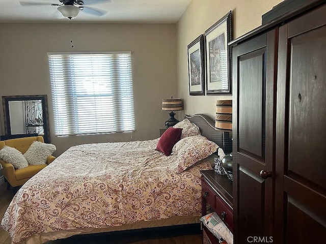 bedroom with hardwood / wood-style floors and ceiling fan