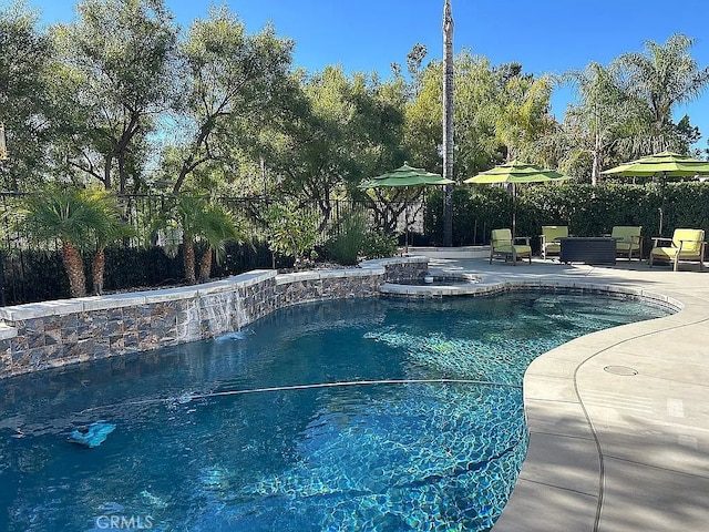 view of swimming pool with a patio