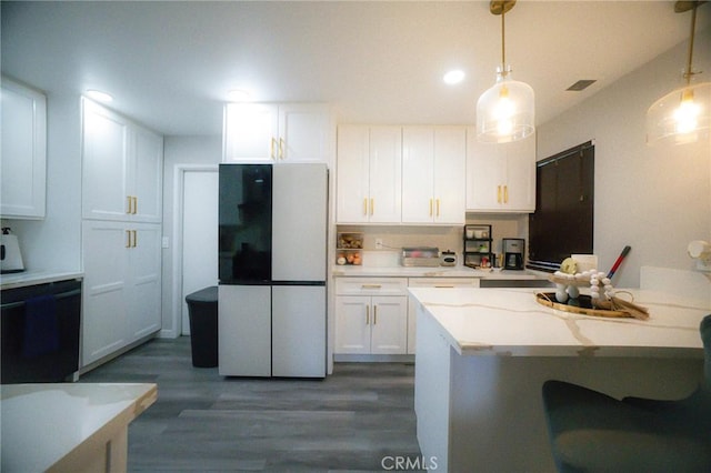 kitchen featuring white cabinetry, dishwasher, dark hardwood / wood-style flooring, white fridge, and decorative light fixtures