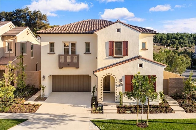 mediterranean / spanish house with a garage