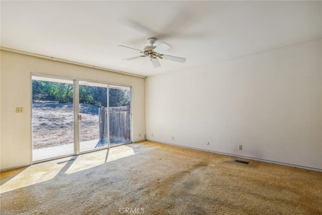 unfurnished room featuring carpet floors and ceiling fan