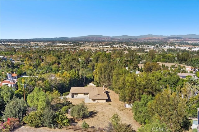 birds eye view of property with a mountain view