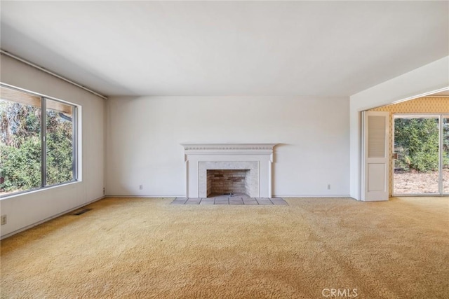 unfurnished living room with light colored carpet