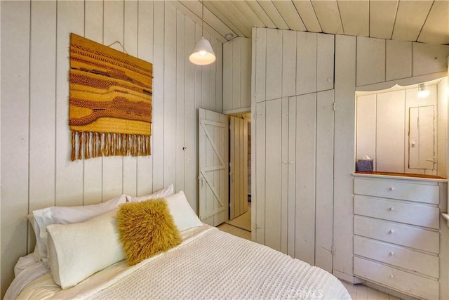 bedroom featuring wood walls, wood ceiling, and vaulted ceiling